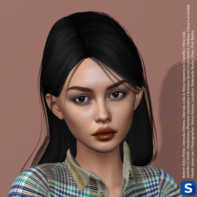 A headshot of Jenny Lee in front of a beige backdrop. She has long black hair, brown eyes and is wearing a plaid shirt. Her lipstick is glossy the color of milk chocolate while her eyeshadow is smoky and subtle.