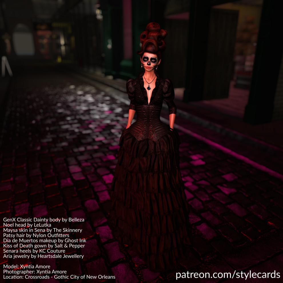 Xyntia Amore is walking along the cobblestone streets of Crossroads - Gothic City of New Orleans at night while wearing a black gown from Salt & Pepper and jewelry by Heartsdale Jewellery. Atop her head is an auburn-colored bouffant hairdo. In the spirit of the season, she is also wearing Dia de Meurtos makeup from Ghost Ink.